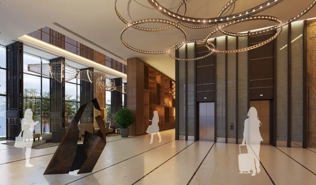 Lift lobby with timber-clad walls, sculptural artwork and a ring chandelier