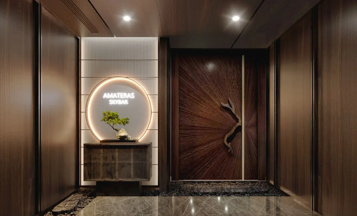 Entrance with a carved timber door, backlit signage and a bonsai display