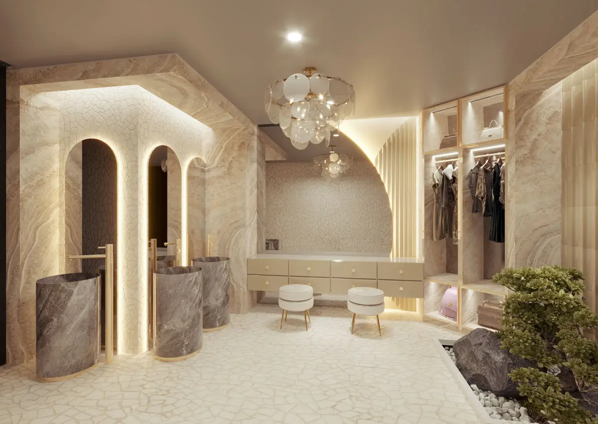 Powder room with arched stone alcoves, a chandelier and a marble counter