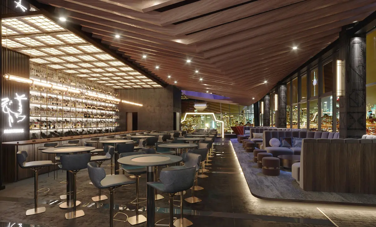 Dining room with a timber slat ceiling, bar seating and bottle-lined walls